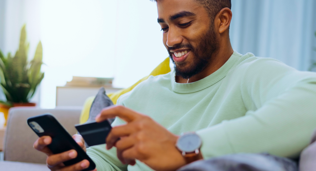 man paying with phone